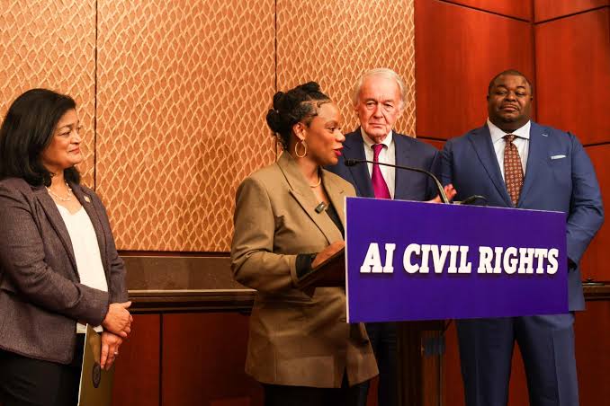 Lawmakers at a Capitol podium reading "AI Civil Rights" announcing the AI Civil Rights Act to stop algorithmic discrimination