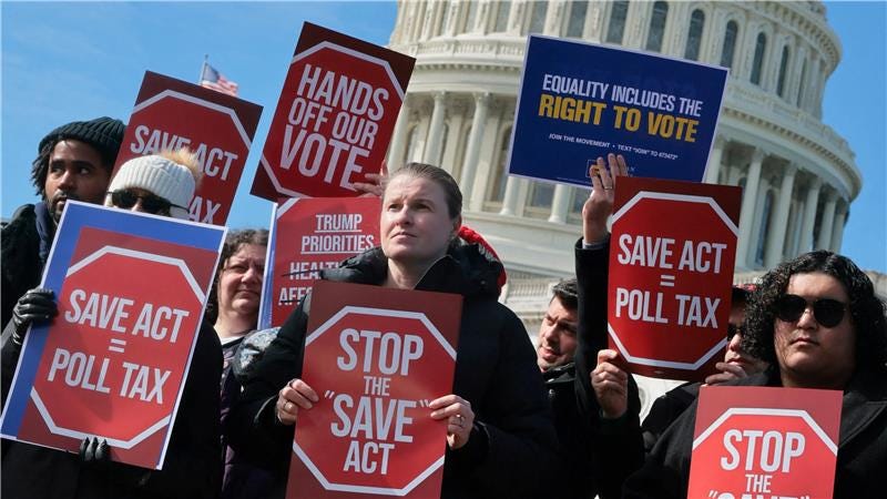 Protesters at the U.S. Capitol holding "SAVE Act = Poll Tax" and "Stop the SAVE Act" signs