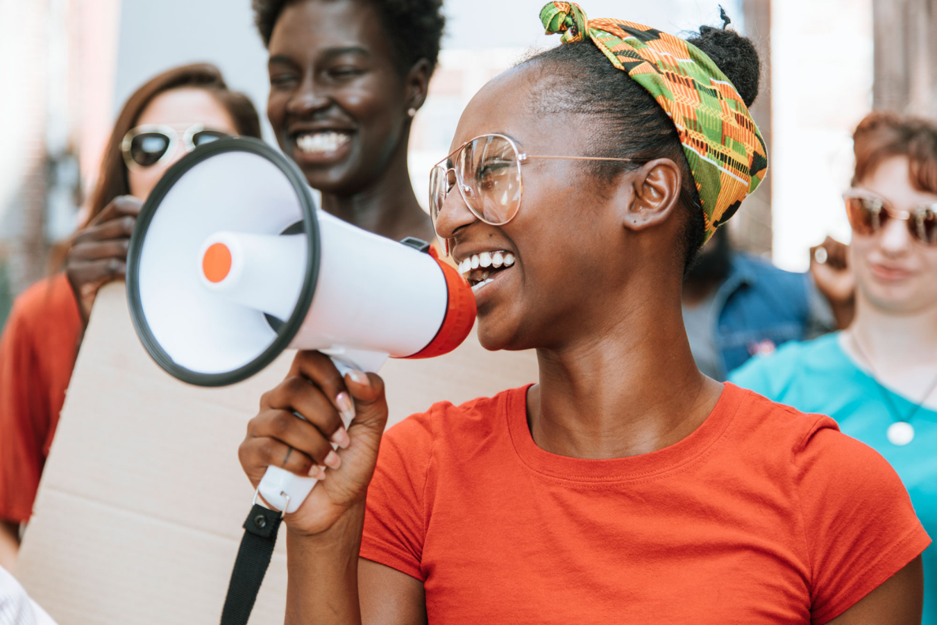 An organizer leads a rally with a megaphone